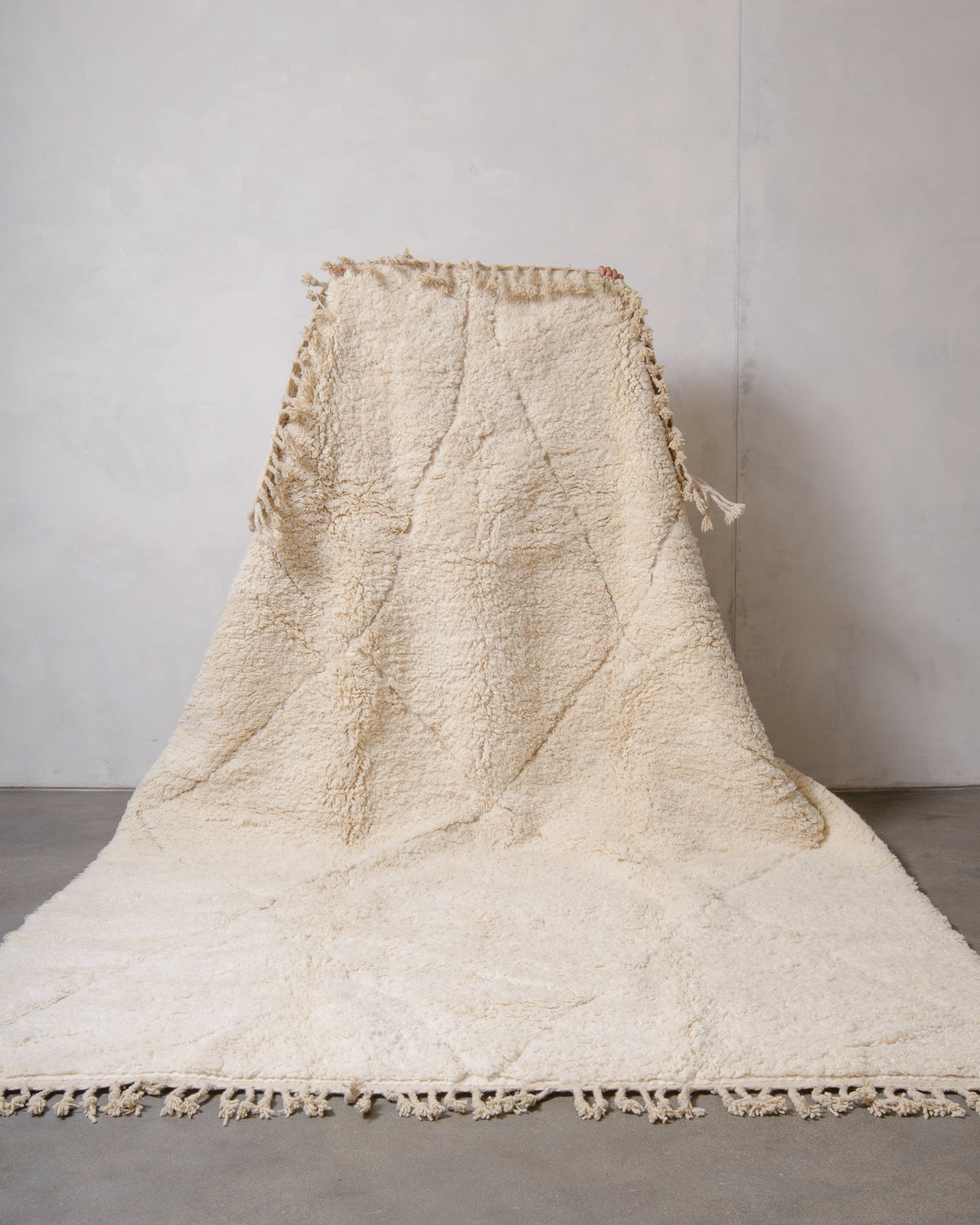 Modern, designer, handcrafted Berber rug from Morocco. Beniourain carpet with minimalist design, natural wool pile and a fluffy texture.